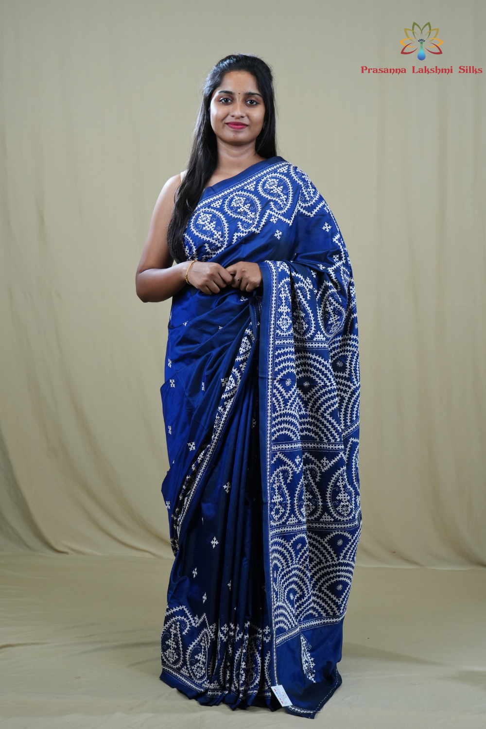 Semi Bangalore Silk Saree with all-over Kutch work motifs and rich embroidered pallu.
