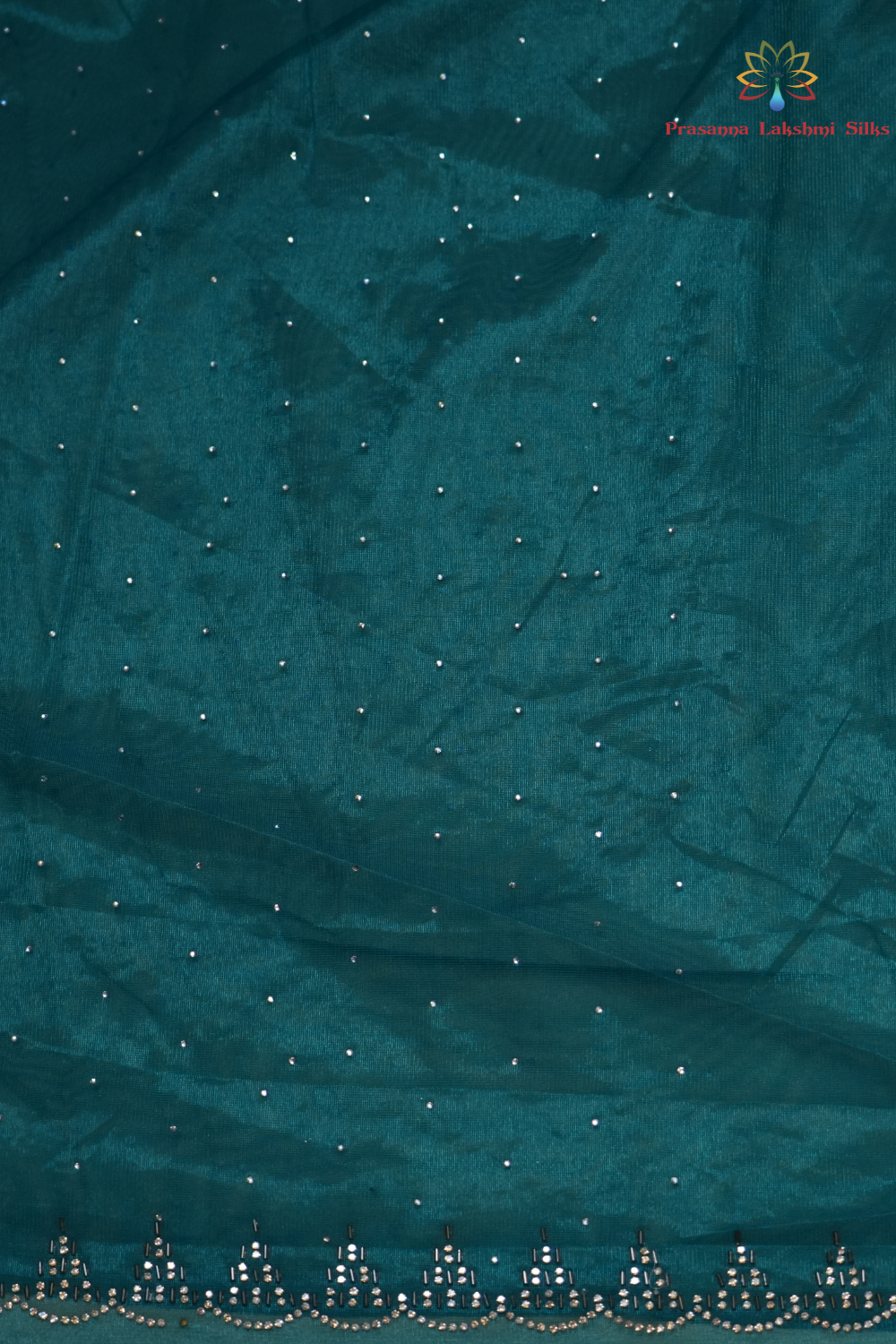 Wedding guest tissue net saree paired with running blouse piece suitable for festive occasions.