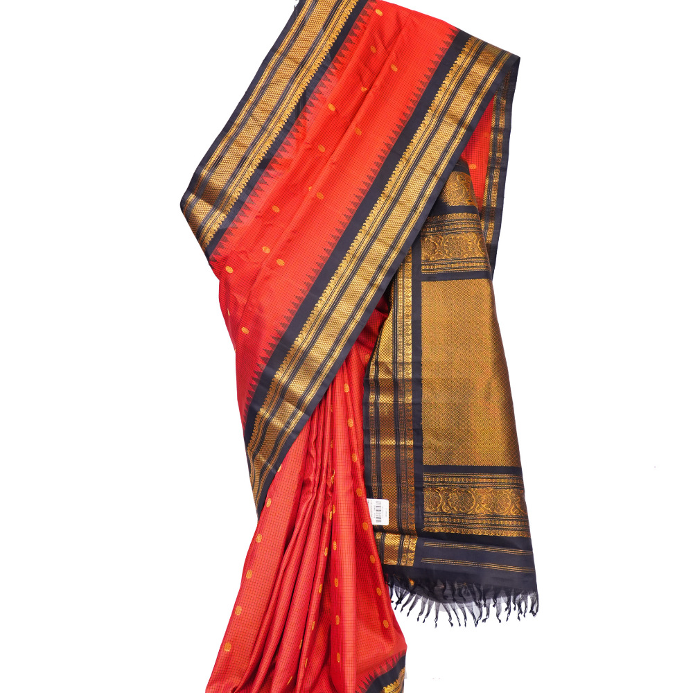 Handloom Gadwal pure silk saree with classic checks pattern and rich zari brocade pallu.
