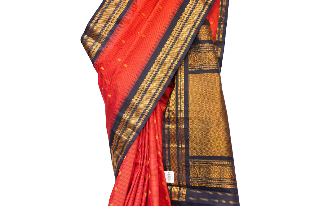 Handloom Gadwal pure silk saree with classic checks pattern and rich zari brocade pallu.
