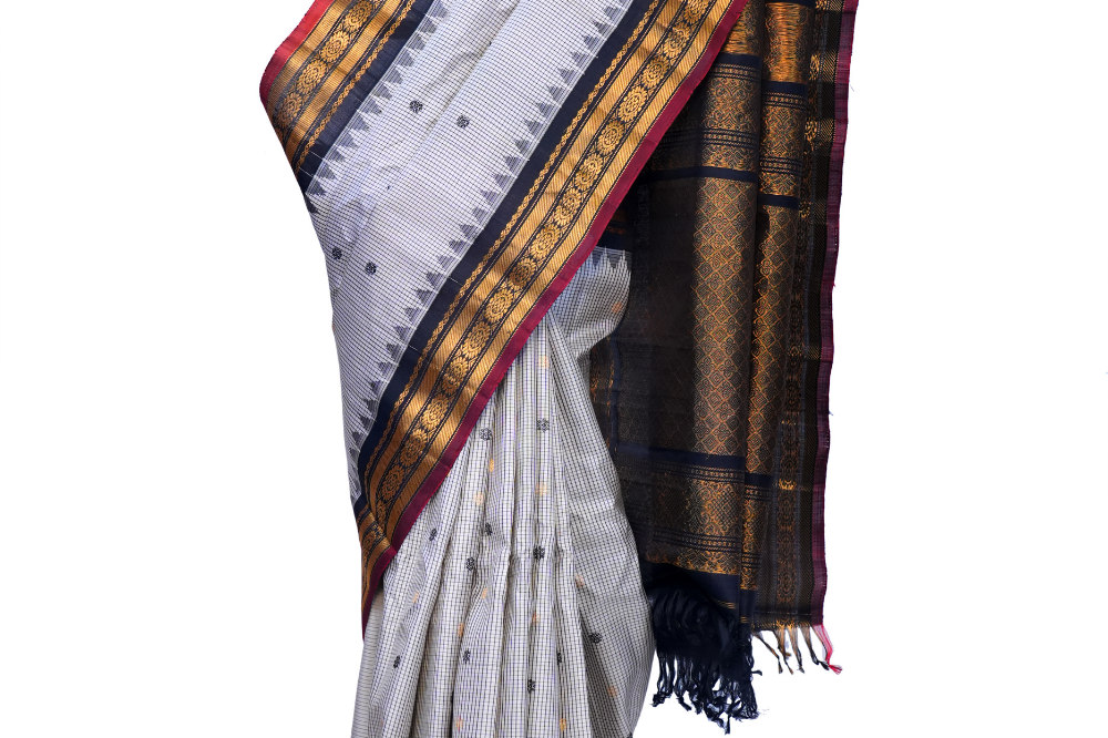 Handloom Gadwal pure silk saree with classic checks pattern and rich zari brocade pallu.

