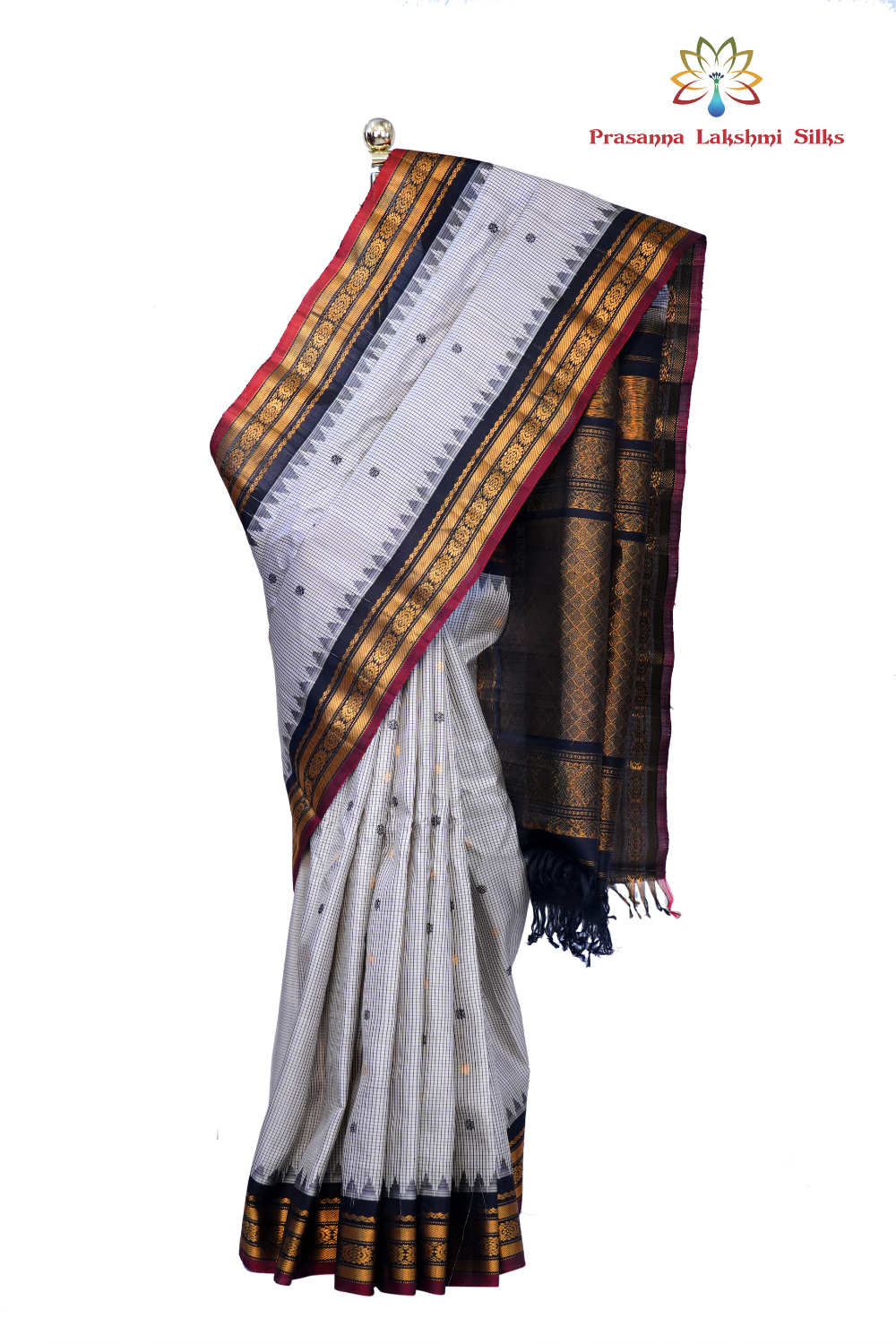 Handloom Gadwal pure silk saree with classic checks pattern and rich zari brocade pallu.
