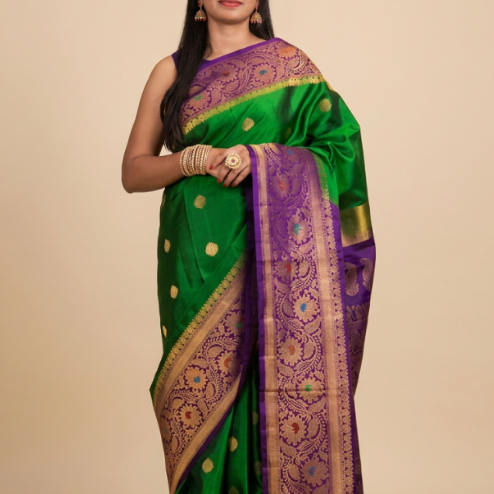 Gadwal Silk Saree featuring all-over zari motifs, intricate meenakari border, rich zari brocade pallu, and contrast blouse.
