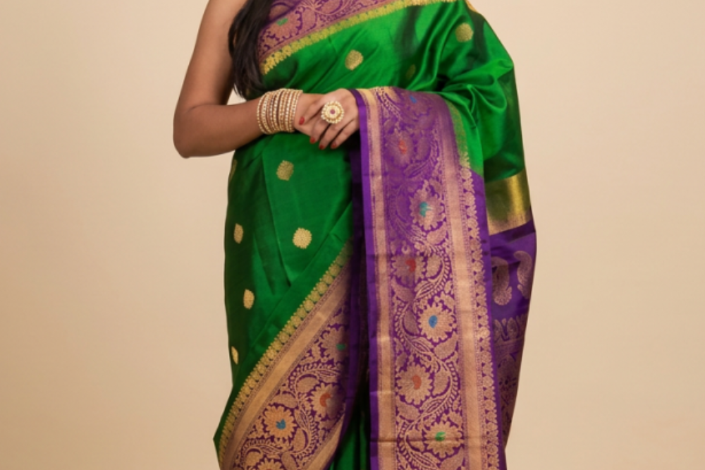 Gadwal Silk Saree featuring all-over zari motifs, intricate meenakari border, rich zari brocade pallu, and contrast blouse.
