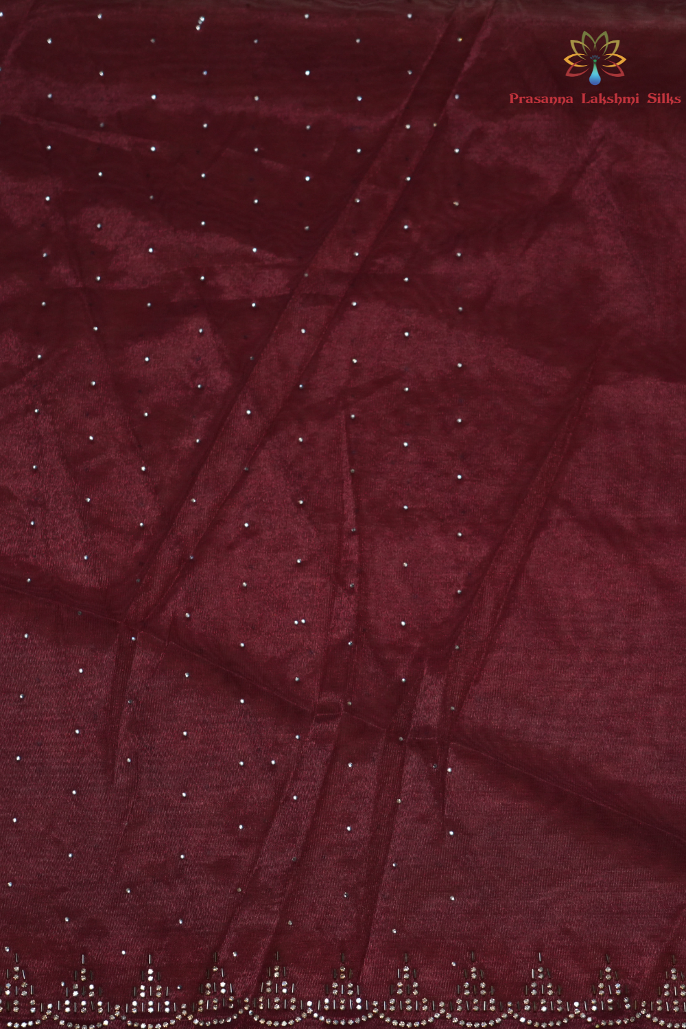 Wedding guest tissue net saree paired with running blouse piece suitable for festive occasions.