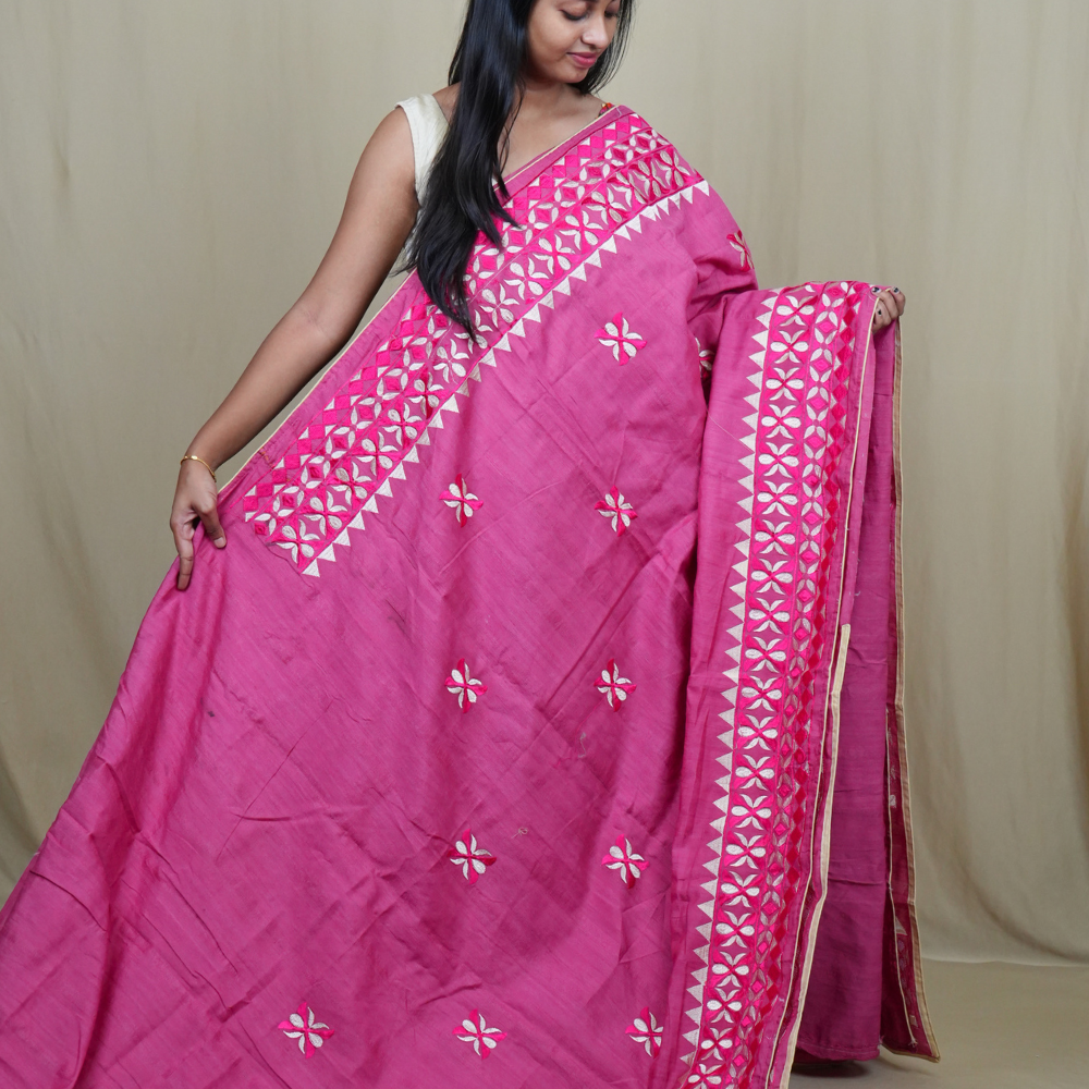 Elegant thread embroidered saree featuring rich pallu design and running blouse piece.
