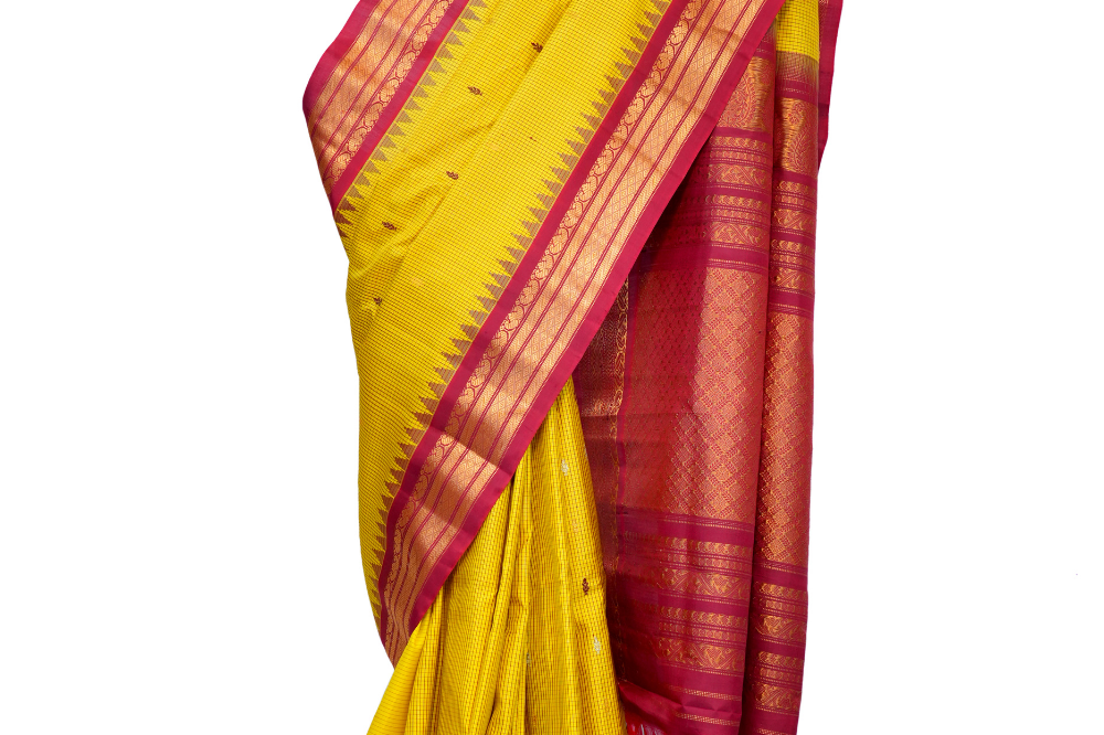 Handloom Gadwal pure silk saree with classic checks pattern and rich zari brocade pallu.
