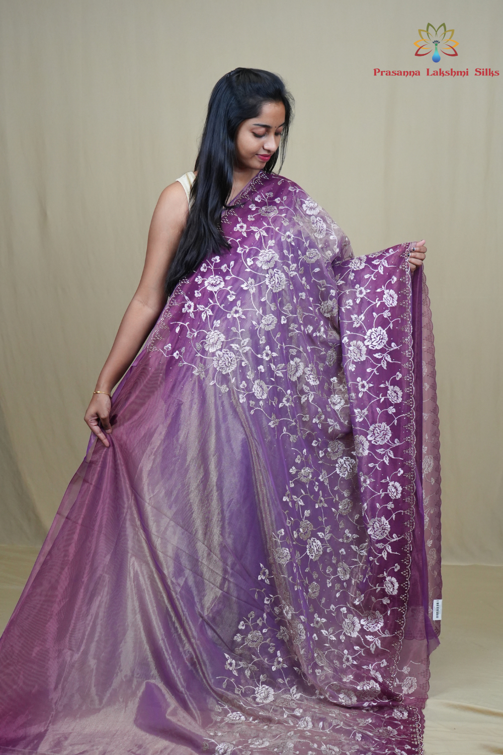 Wedding guest tissue net saree paired with running blouse piece suitable for festive occasions.