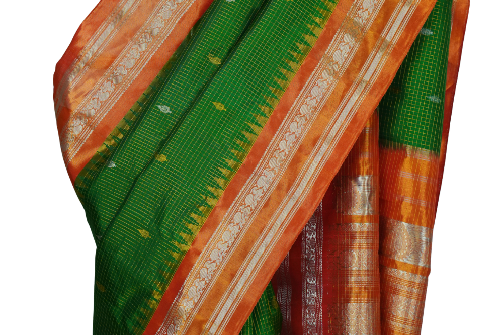 Handloom Gadwal pure tissue silk saree with intricate zari motifs and muniya borders.
