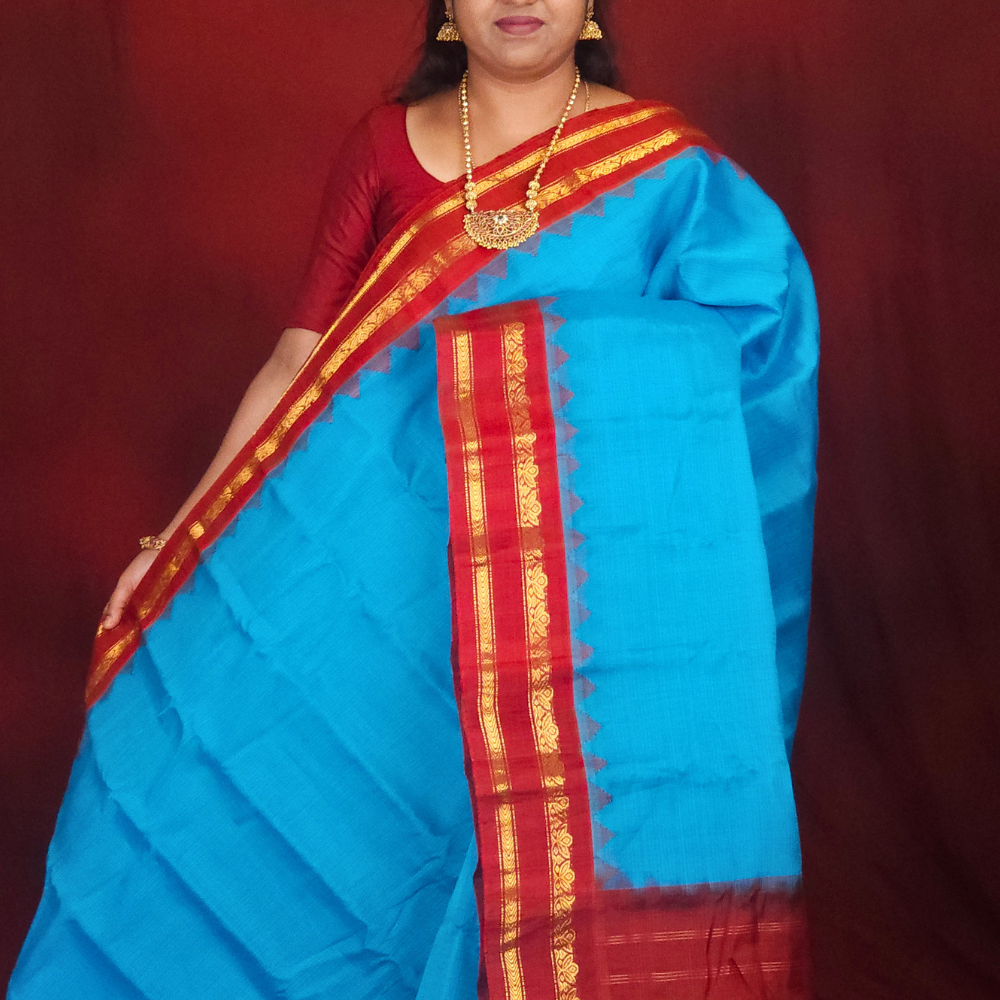 Lightweight Gadwal cotton saree featuring elegant zari border and striped pallu design.
