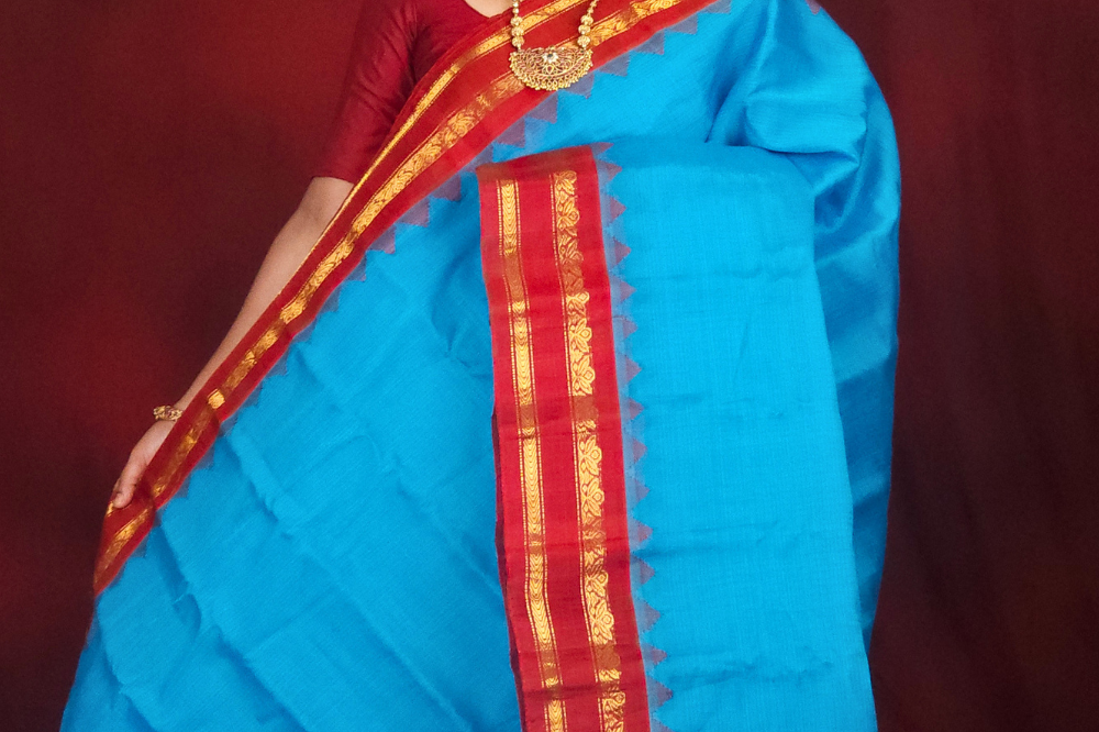 Lightweight Gadwal cotton saree featuring elegant zari border and striped pallu design.
