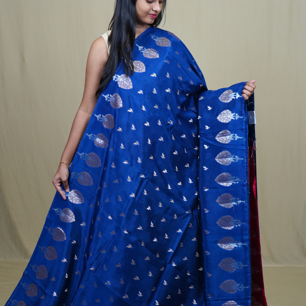 Traditional Banarasi silk saree featuring rich brocade pallu and matching brocade blouse.
