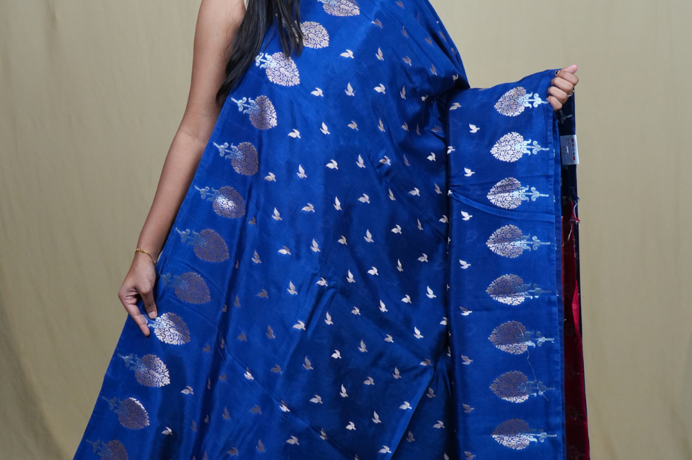 Traditional Banarasi silk saree featuring rich brocade pallu and matching brocade blouse.
