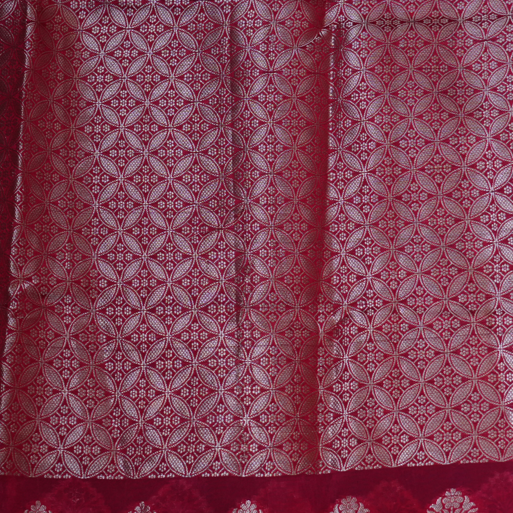 Elegant Banarasi Munga silk saree suitable for weddings and grand celebrations with intricate zari detailing.