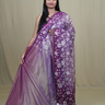 Exquisite Tissue Net Saree with all-over silver zari floral embroidery and bead detailing.
