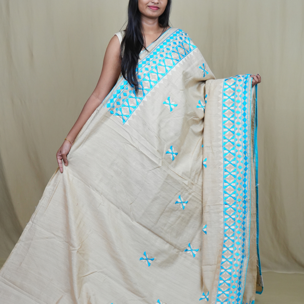 Elegant thread embroidered saree featuring rich pallu design and running blouse piece.
