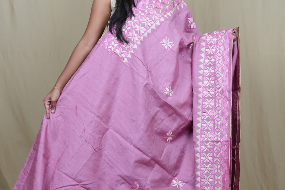 Elegant thread embroidered saree featuring rich pallu design and running blouse piece.

