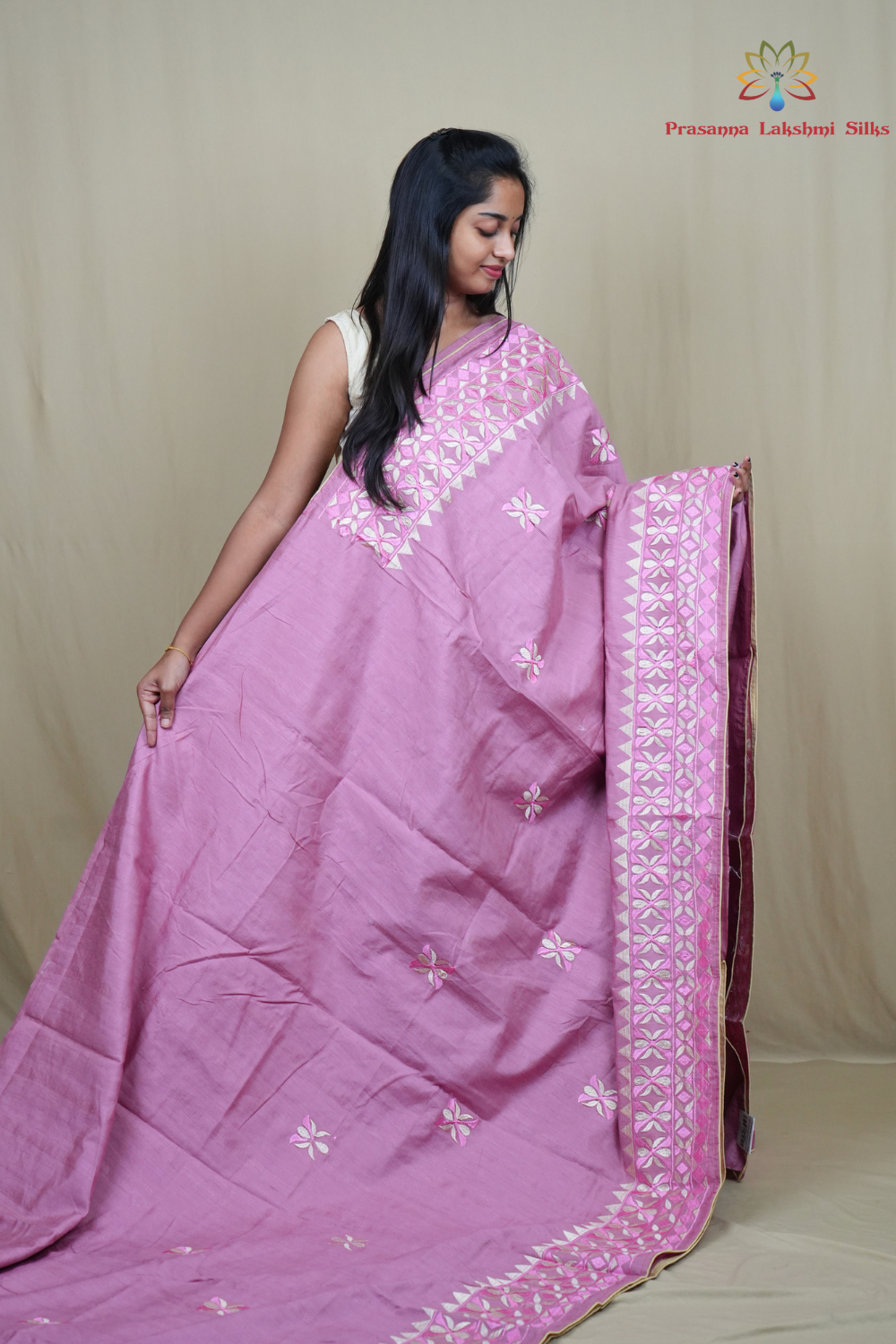 Elegant thread embroidered saree featuring rich pallu design and running blouse piece.
