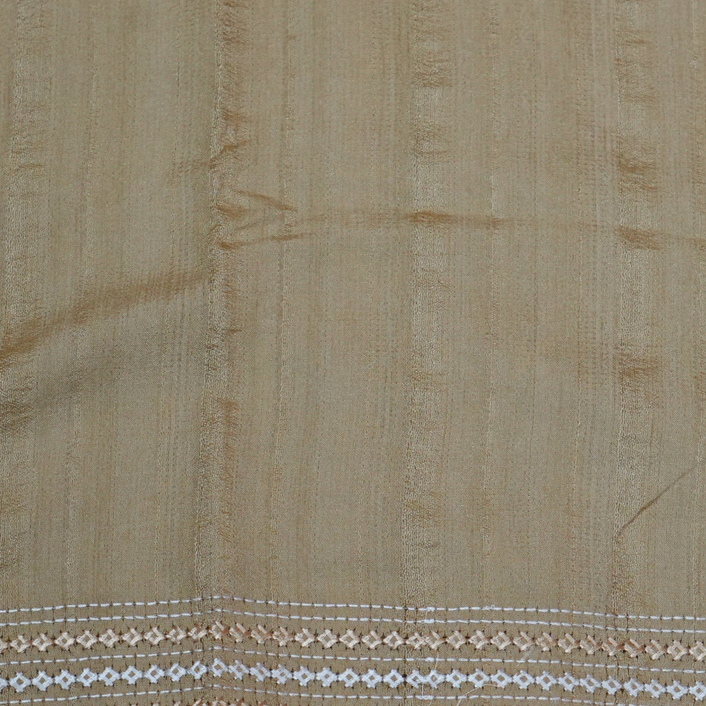 Elegant thread embroidered saree featuring rich Kutch work pallu and running blouse piece.
