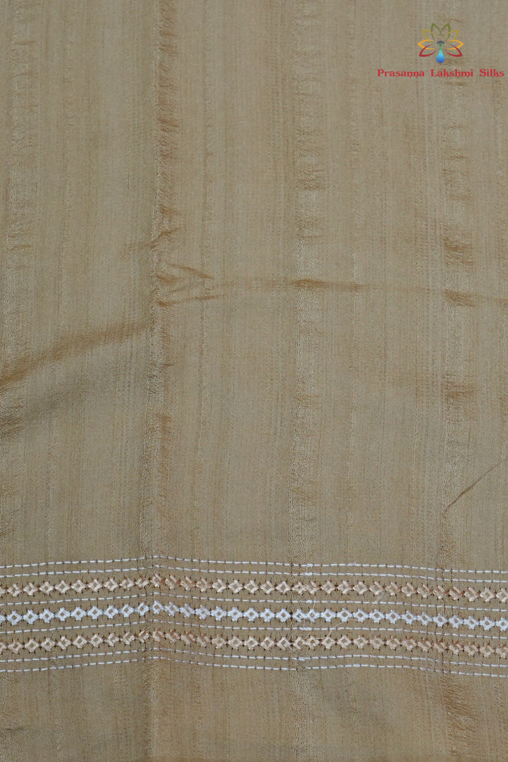 Elegant thread embroidered saree featuring rich Kutch work pallu and running blouse piece.
