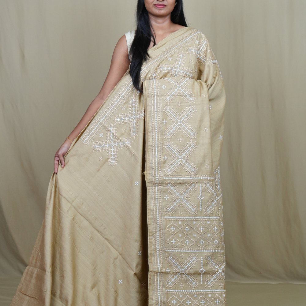 Semi Tussar silk saree with all-over small Kutch work motifs and beautiful borders.
