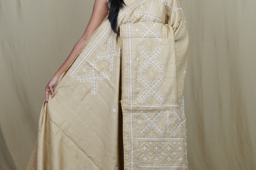 Semi Tussar silk saree with all-over small Kutch work motifs and beautiful borders.
