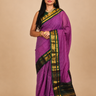 Pure handloom Gadwal cotton saree with traditional zari woven borders and simple zari stripes pallu.
