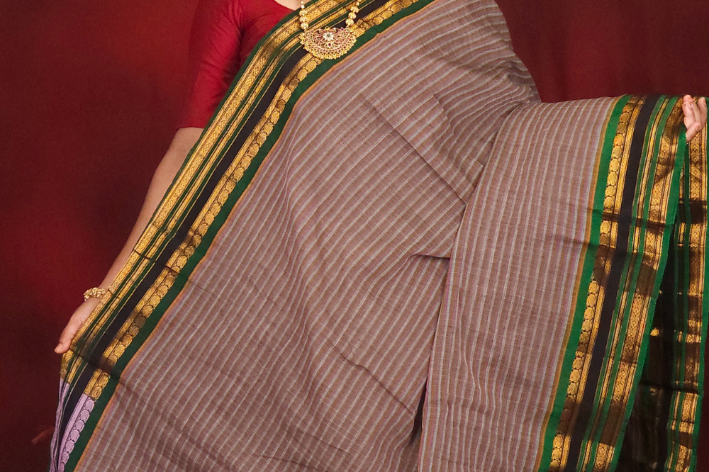 Lightweight Gadwal cotton saree featuring elegant zari border and striped pallu design.
