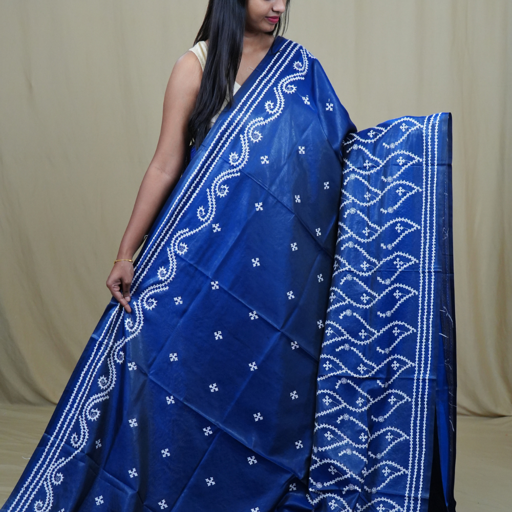 Traditional semi silk saree featuring beautiful hand Kutch work borders and artistic design.
