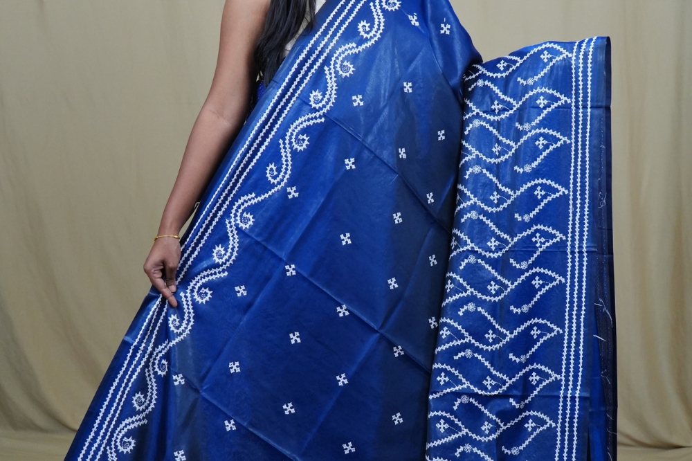 Traditional semi silk saree featuring beautiful hand Kutch work borders and artistic design.
