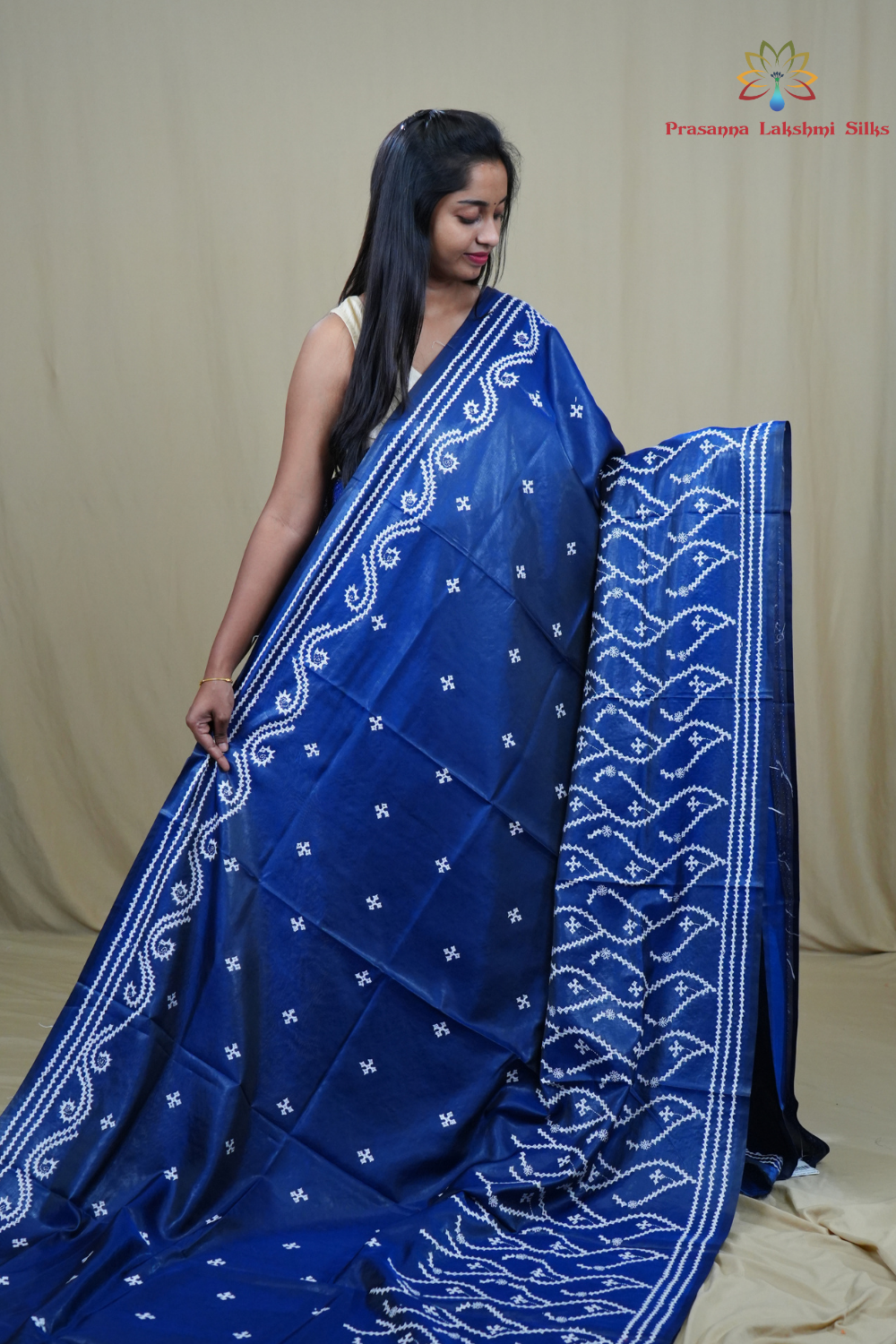 Traditional semi silk saree featuring beautiful hand Kutch work borders and artistic design.
