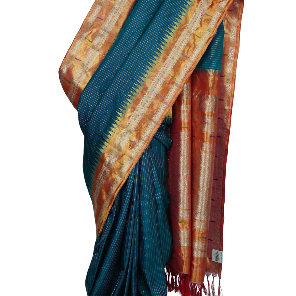Handloom Gadwal pure tissue silk saree with intricate zari motifs and muniya borders.
