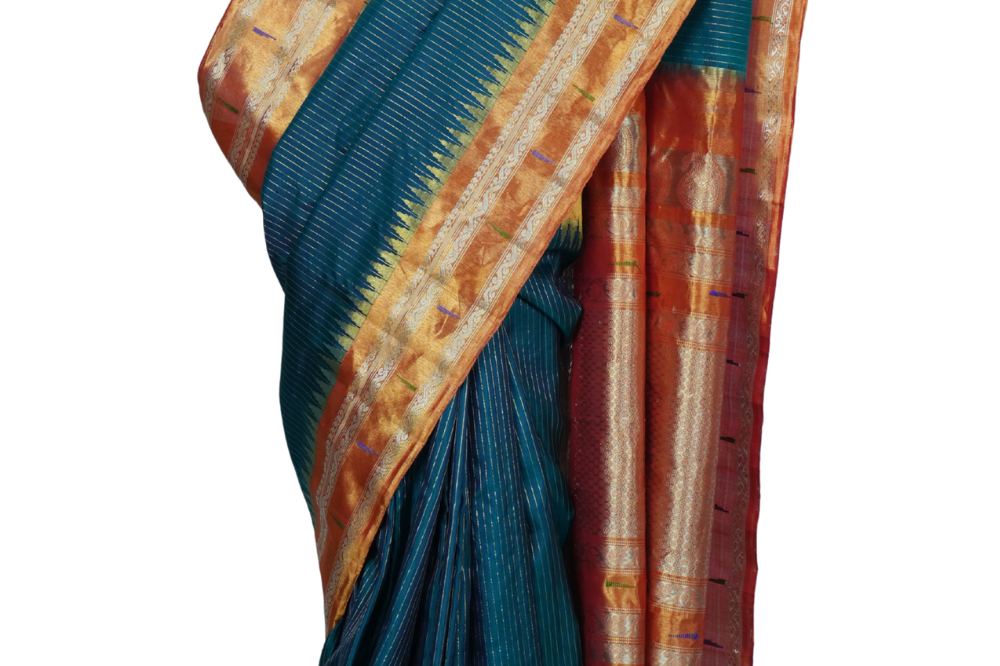 Handloom Gadwal pure tissue silk saree with intricate zari motifs and muniya borders.
