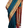 Handloom Gadwal pure tissue silk saree with intricate zari motifs and muniya borders.
