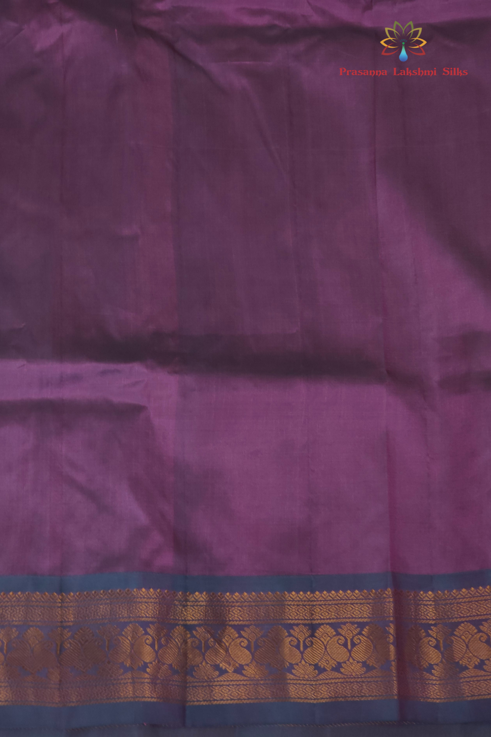 Baby pink Gadwal saree draped, showing rich brocade pallu and matching teal green blouse