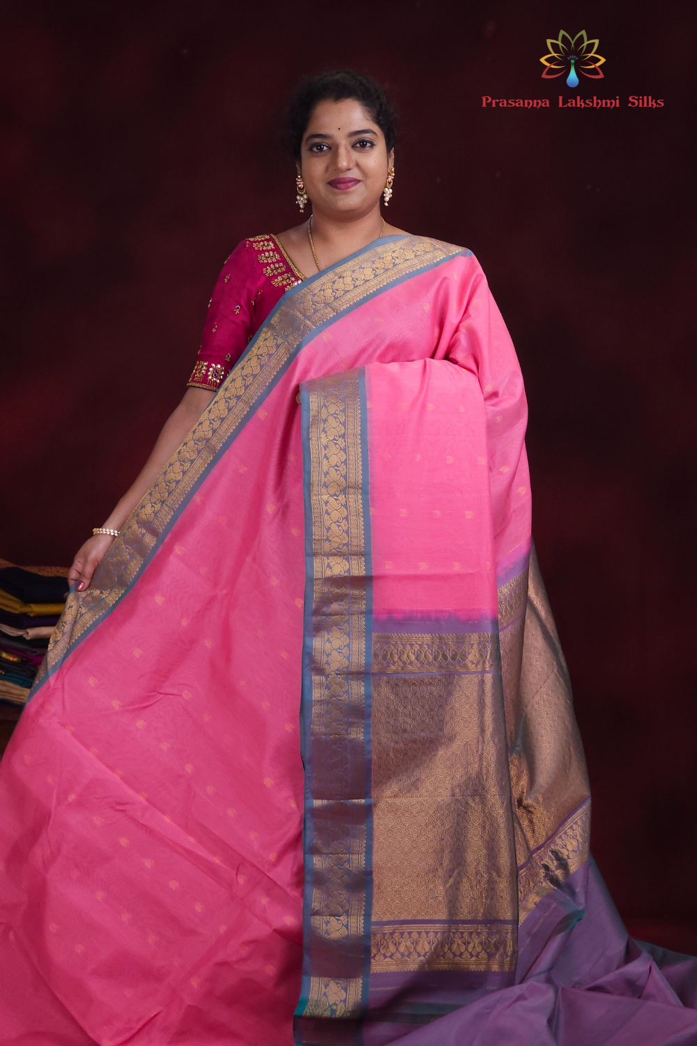 Baby pink Gadwal silk cotton saree with light teal green zari-woven border