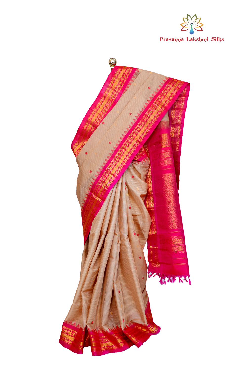 Handloom Gadwal silk cotton saree with all-over zari buttis and rich brocade pallu.
