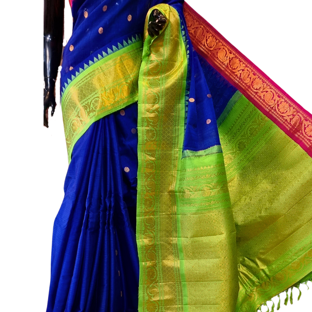 Handloom Gadwal silk cotton saree with all-over zari buttis and rich brocade pallu.
