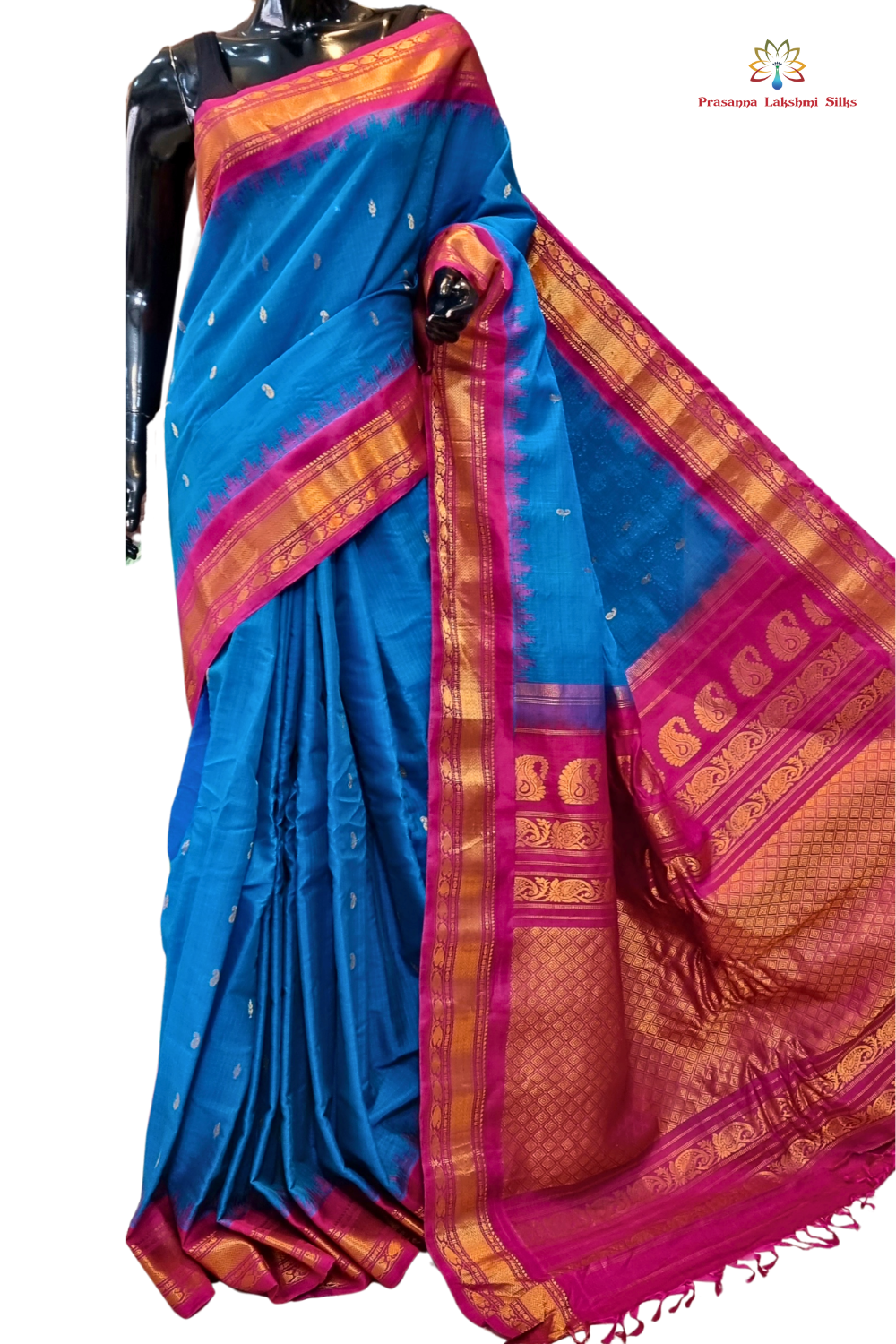 Handloom Gadwal silk cotton saree with all-over zari buttis and rich brocade pallu.
