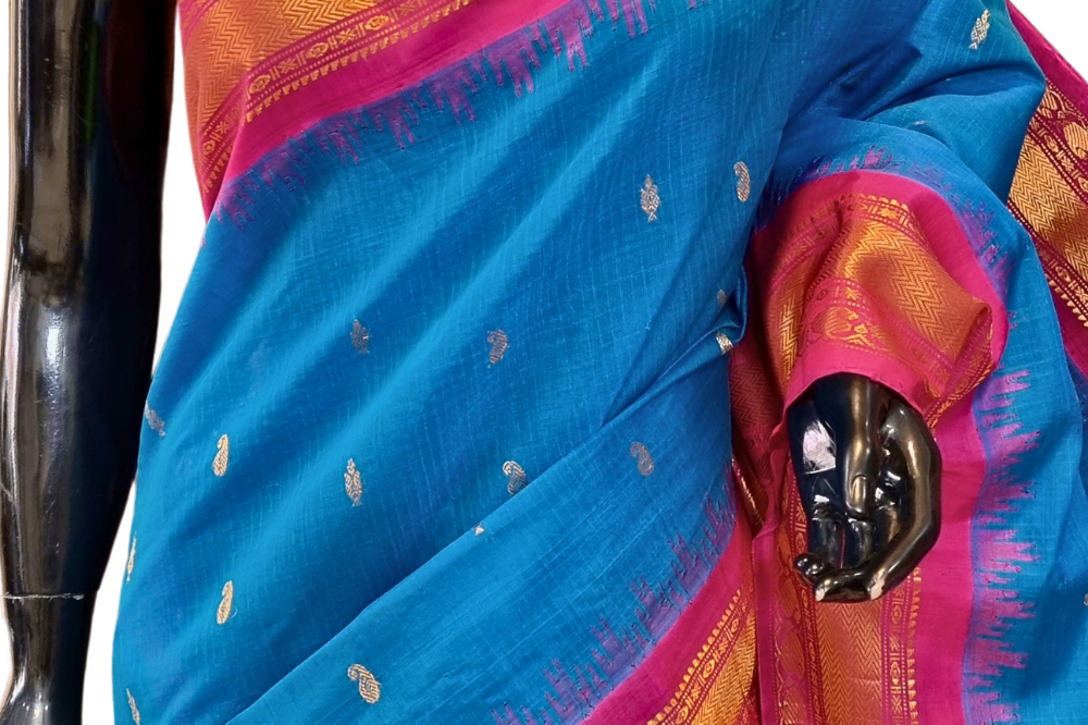Traditional Gadwal SiCo saree featuring exquisite zari woven borders and blouse piece.
