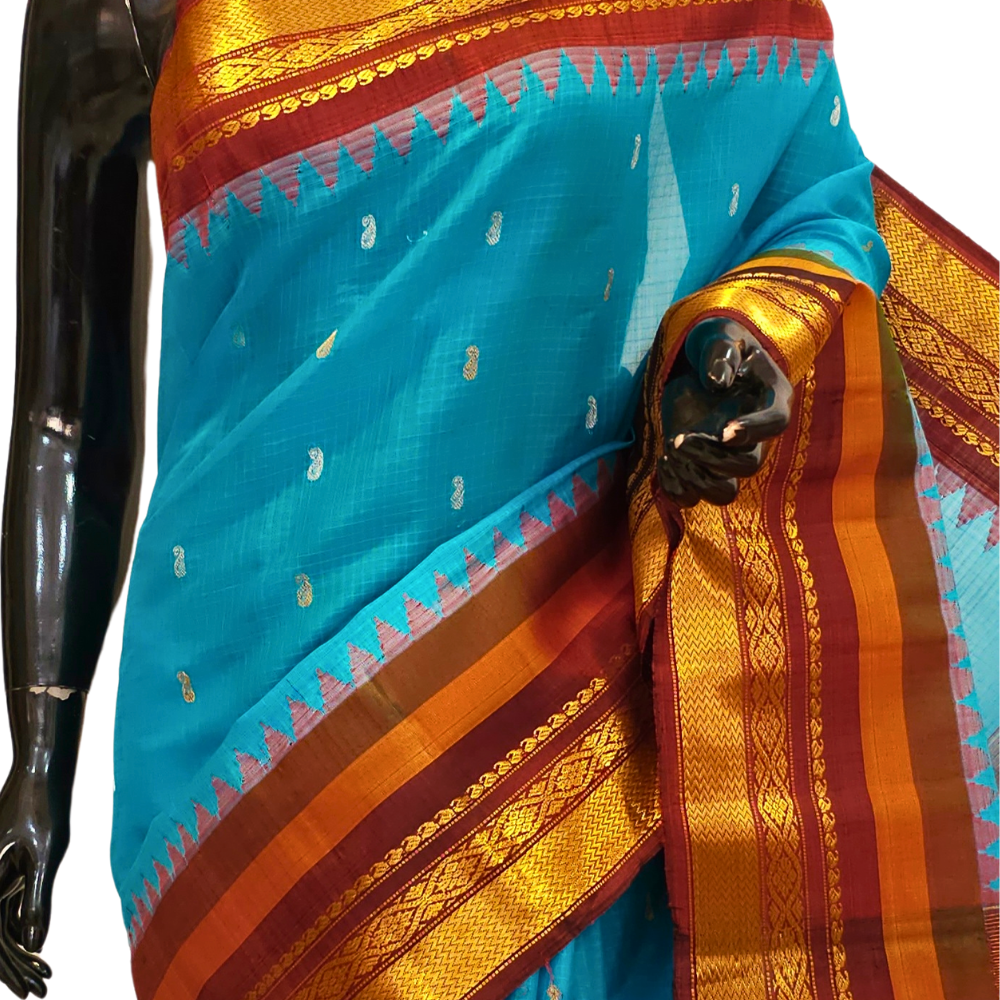 Traditional Gadwal SiCo saree featuring exquisite zari woven borders and blouse piece.
