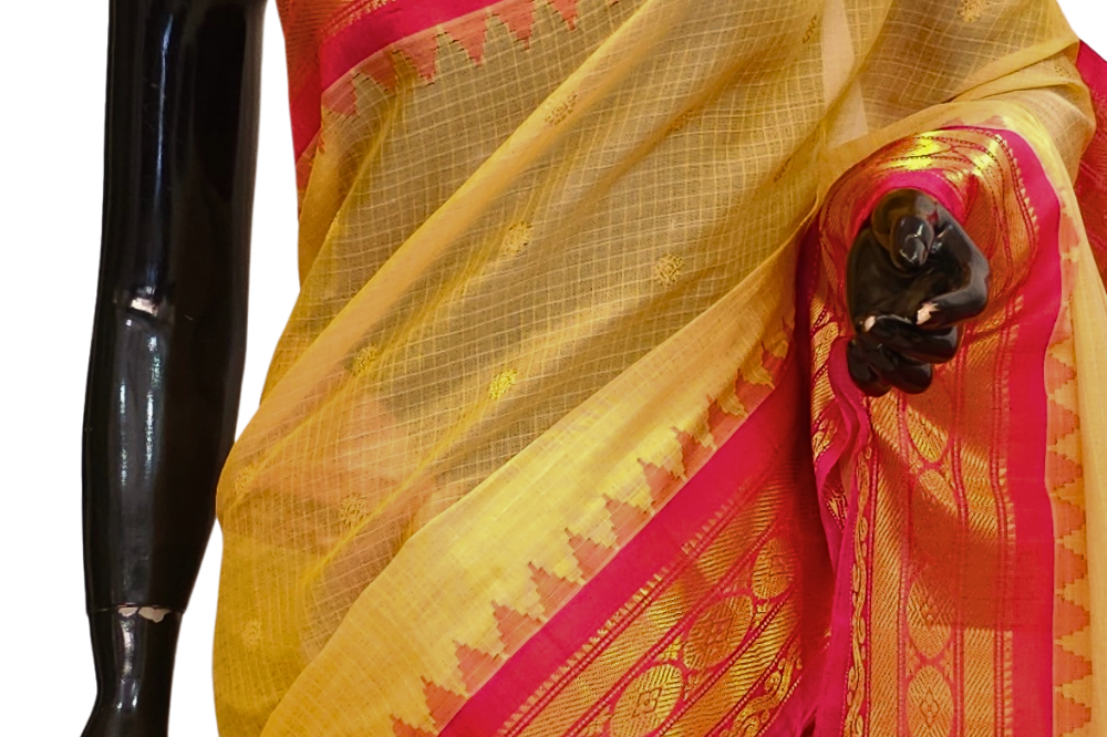 Traditional Gadwal SiCo saree featuring exquisite zari woven borders and blouse piece.

