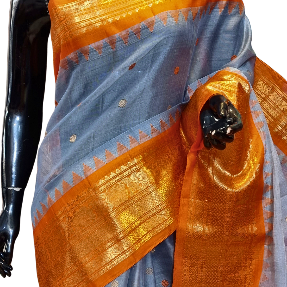 Traditional Gadwal SiCo saree featuring exquisite zari woven borders and blouse piece.

