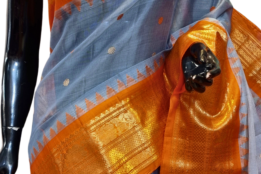 Traditional Gadwal SiCo saree featuring exquisite zari woven borders and blouse piece.
