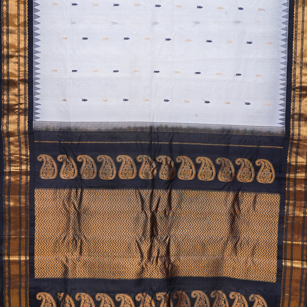 Traditional Gadwal SiCo saree featuring exquisite zari woven borders and blouse piece.
