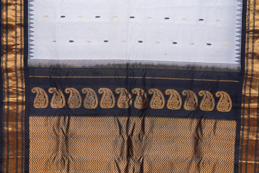 Traditional Gadwal SiCo saree featuring exquisite zari woven borders and blouse piece.
