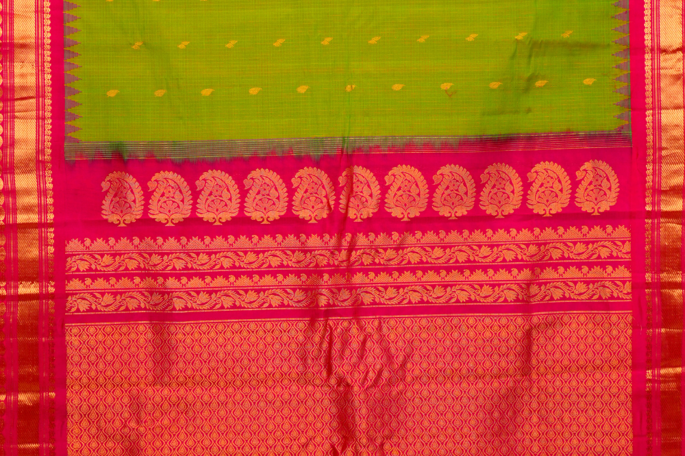 Traditional Gadwal SiCo saree featuring exquisite zari woven borders and blouse piece.
