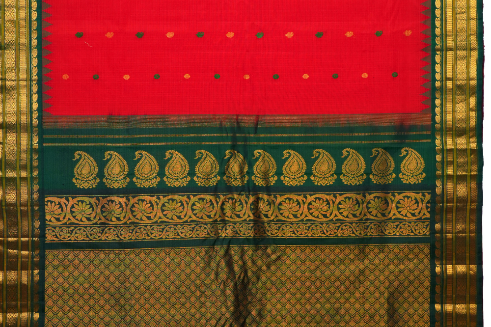 Traditional Gadwal SiCo saree featuring exquisite zari woven borders and blouse piece.
