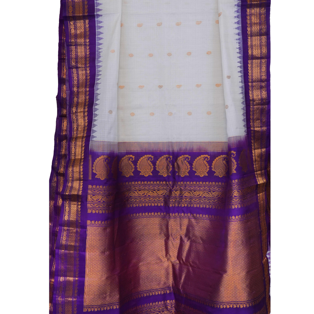 Traditional Gadwal SiCo saree featuring exquisite zari woven borders and blouse piece.
