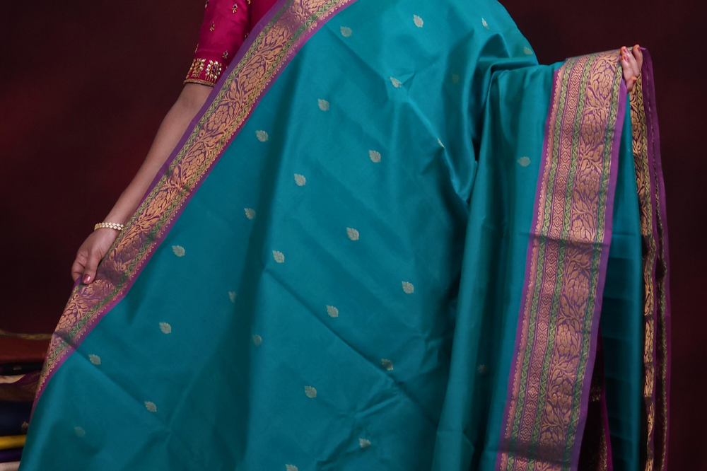 Close-up of zari motif detailing on Rama Green Gadwal saree